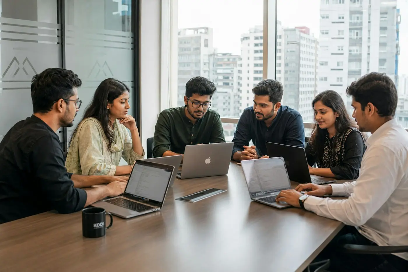 Marketing team planning an SEO and paid ads strategy in an office